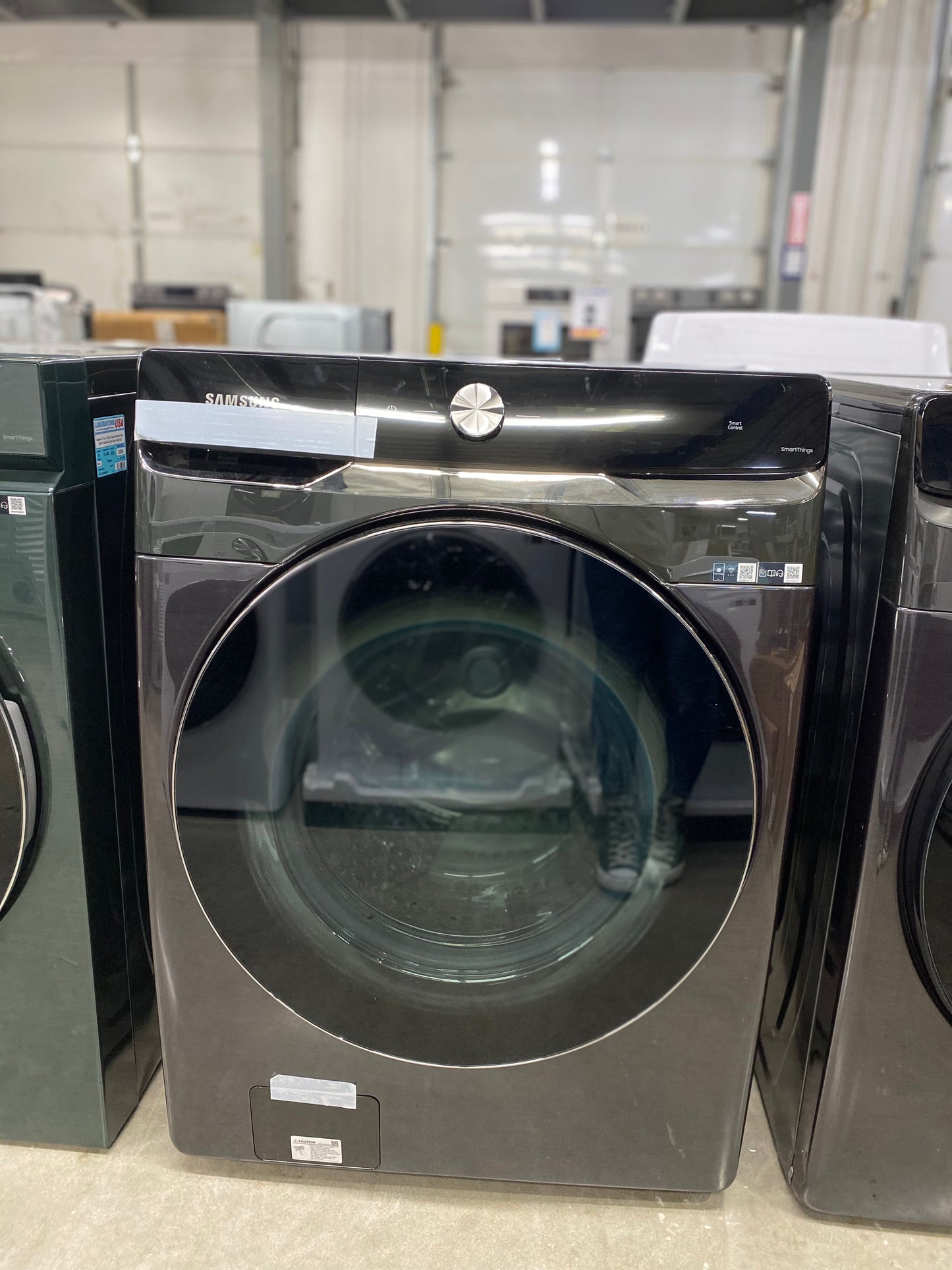 5.0 cu. ft. Extra-Large Capacity Smart Dial Front Load Washer with OptiWash™ ( dent on the left side )