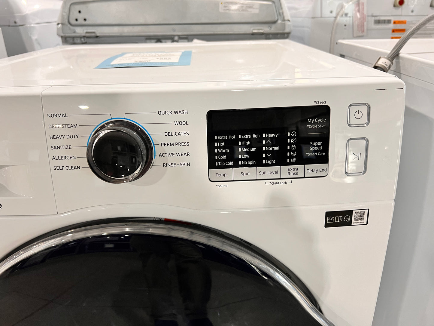 2.2 Cu. Ft. High Efficiency Stackable Front Load Washer with Steam( missing bottom access panel)