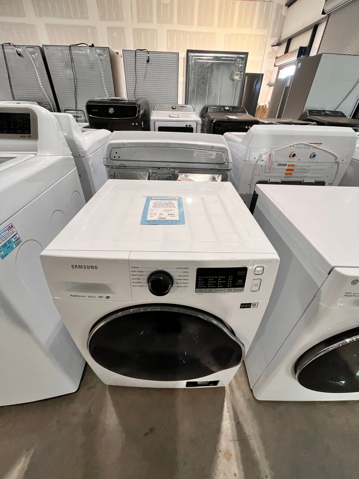 2.2 Cu. Ft. High Efficiency Stackable Front Load Washer with Steam( missing bottom access panel)