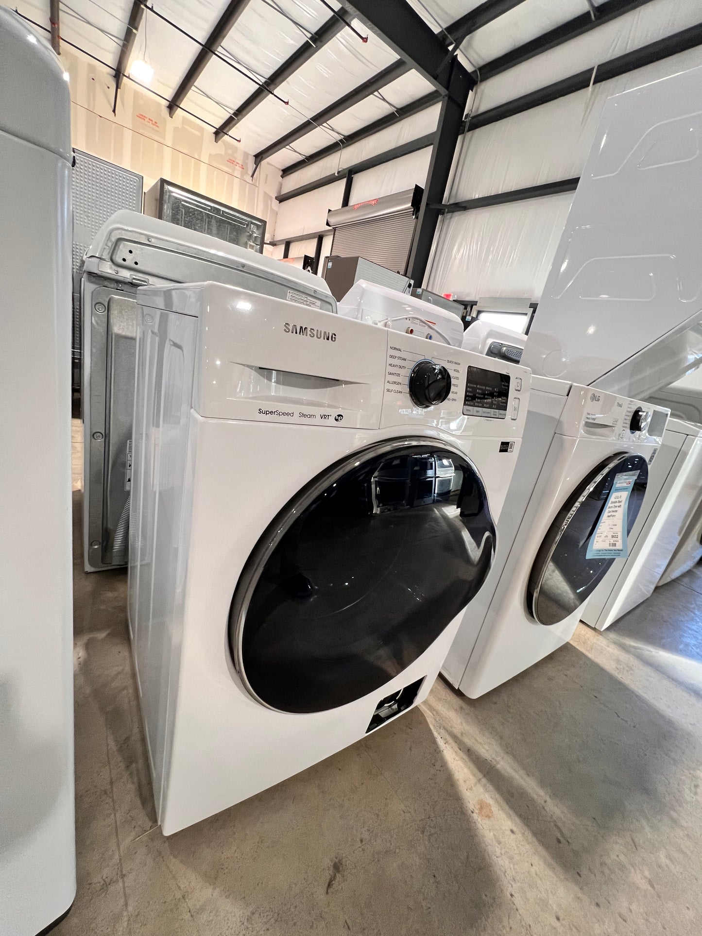 2.2 Cu. Ft. High Efficiency Stackable Front Load Washer with Steam( missing bottom access panel)