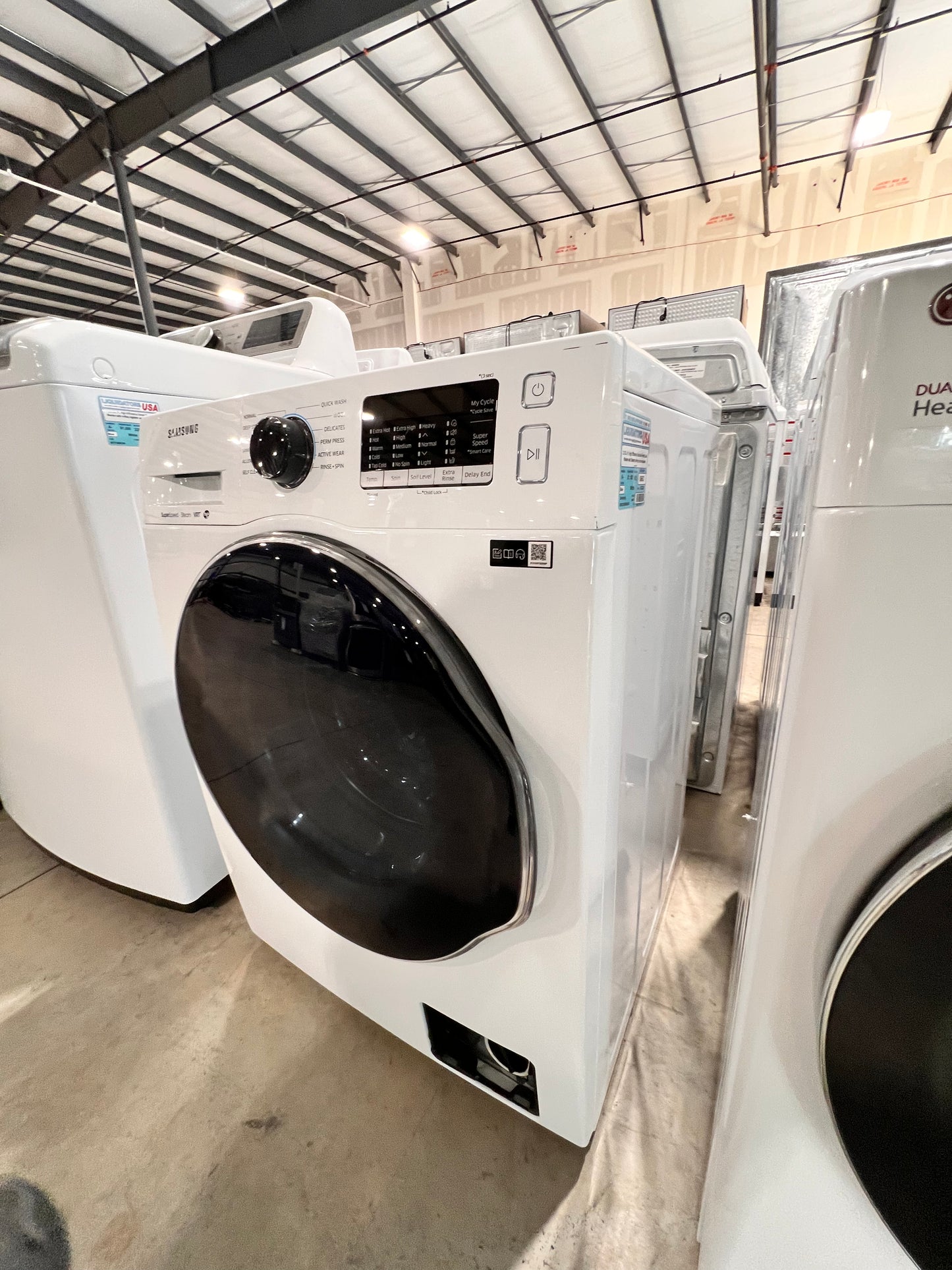 2.2 Cu. Ft. High Efficiency Stackable Front Load Washer with Steam( missing bottom access panel)